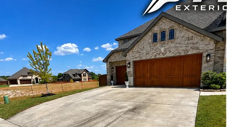 Driveway concrete before and after cleaning by FLOW — before cleaning